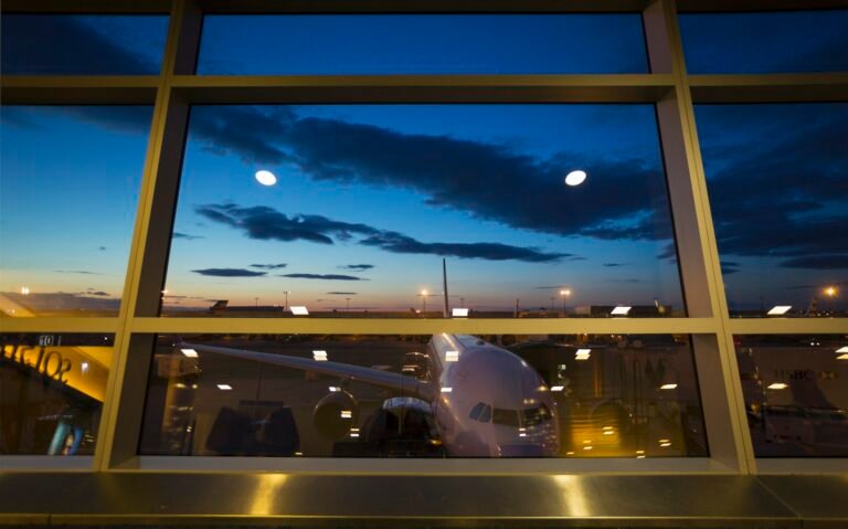 Airport terminal window view of airplane, New York, USA