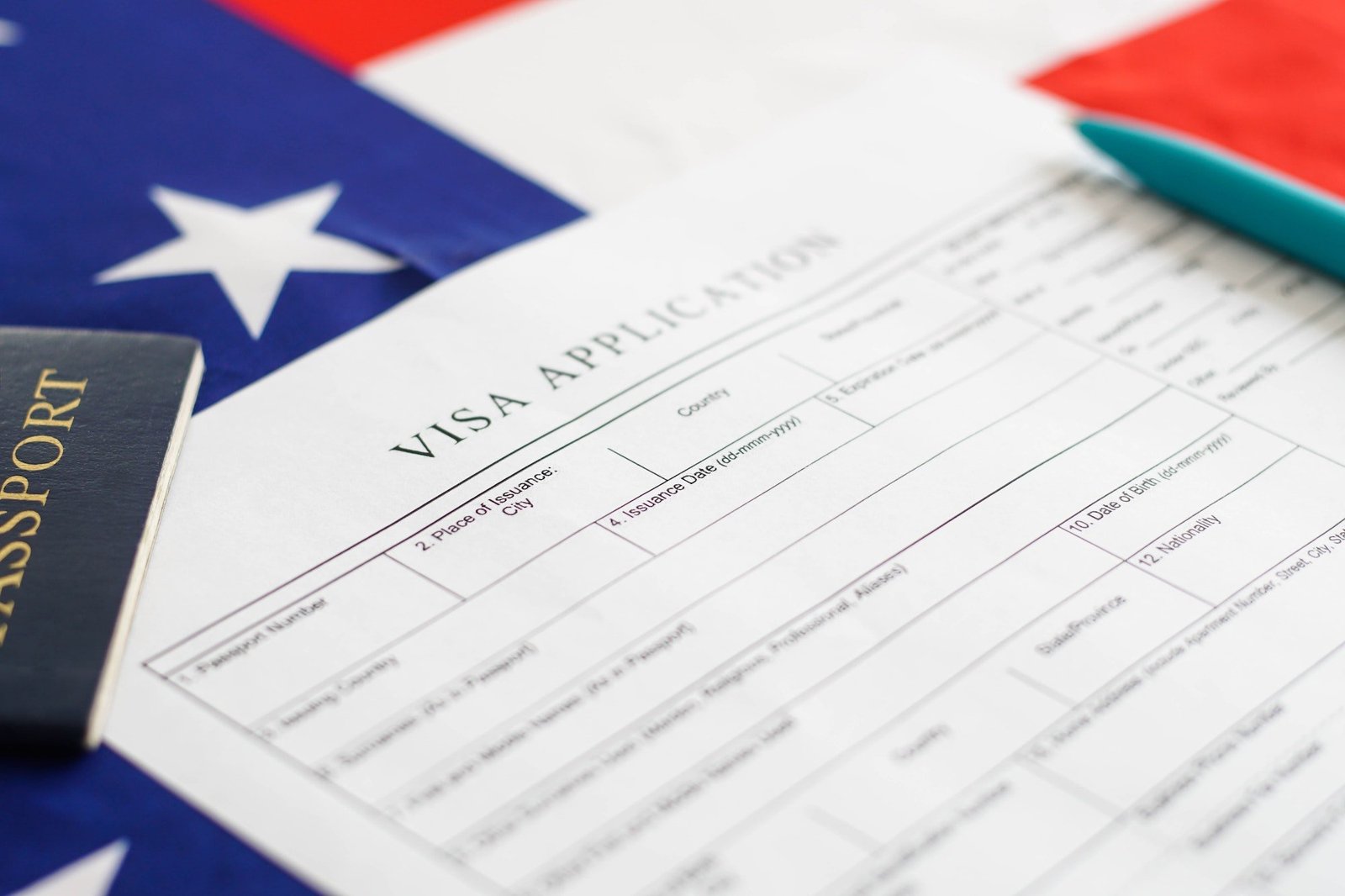 Woman filling visa application form. American flag on the background. Immigration to USA.