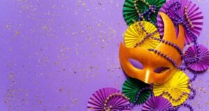 Mardi gras.Holidays mardi gras masquarade, venetian mask fan over purple background. view above,ma